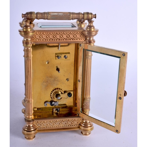 393 - A FRENCH BRASS CARRIAGE CLOCK with circular enamelled dial. 15 cm high.