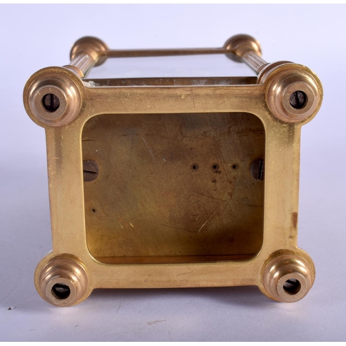 393 - A FRENCH BRASS CARRIAGE CLOCK with circular enamelled dial. 15 cm high.