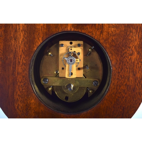 394 - AN ANTIQUE ENGLISH SILVER OVERLAID NEO CLASSICAL MANTEL CLOCK decorated with flowers. 40 cm high.