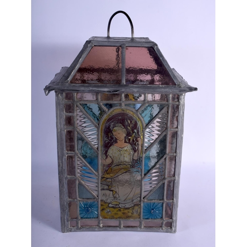 395 - A FINE ARTS AND CRAFTS ENGLISH STAINED GLASS LANTERN decorated with the four seasons. 42 cm x 24 cm.