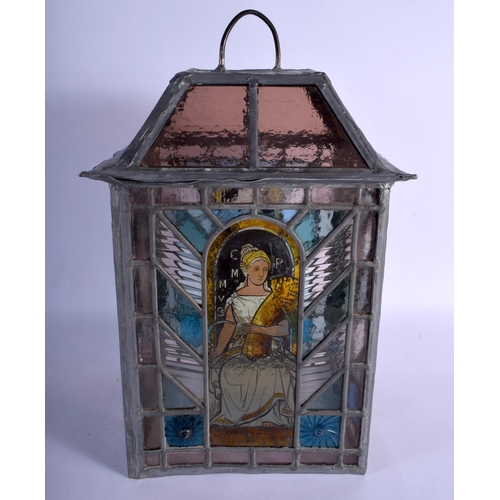 395 - A FINE ARTS AND CRAFTS ENGLISH STAINED GLASS LANTERN decorated with the four seasons. 42 cm x 24 cm.
