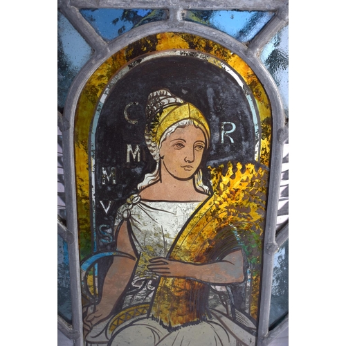 395 - A FINE ARTS AND CRAFTS ENGLISH STAINED GLASS LANTERN decorated with the four seasons. 42 cm x 24 cm.
