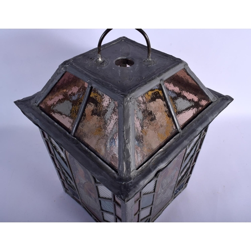 395 - A FINE ARTS AND CRAFTS ENGLISH STAINED GLASS LANTERN decorated with the four seasons. 42 cm x 24 cm.