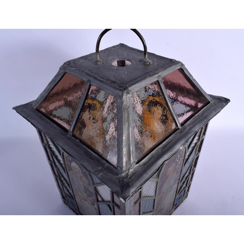 395 - A FINE ARTS AND CRAFTS ENGLISH STAINED GLASS LANTERN decorated with the four seasons. 42 cm x 24 cm.