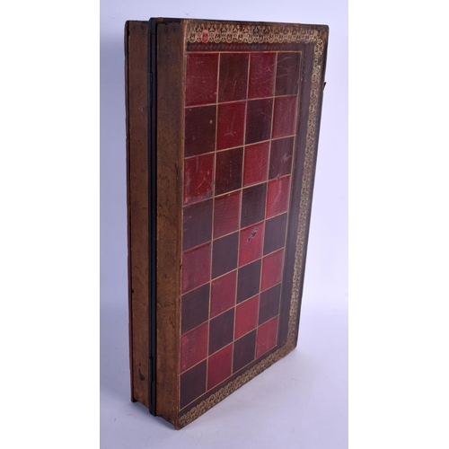 396 - A CHARMING ANTIQUE BOXWOOD AND EBONY CHESS SET within a case, together with a folding faux leather b... 