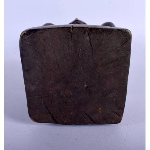 399 - AN UNUSUAL AFRICAN TRIBAL CARVED WOOD FIGURE modelled with inset stud work and scarred face. 25 cm h... 