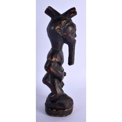 400 - AN AFRICAN TRIBAL CARVED WOOD FIGURE modelled as a male with a long beard. 24 cm high.