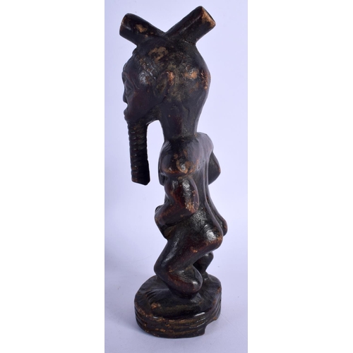 400 - AN AFRICAN TRIBAL CARVED WOOD FIGURE modelled as a male with a long beard. 24 cm high.