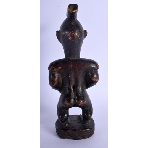 400 - AN AFRICAN TRIBAL CARVED WOOD FIGURE modelled as a male with a long beard. 24 cm high.