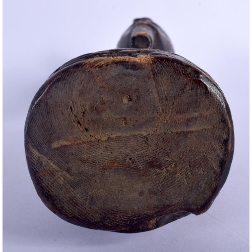 400 - AN AFRICAN TRIBAL CARVED WOOD FIGURE modelled as a male with a long beard. 24 cm high.