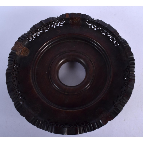 408 - A LARGE 19TH CENTURY CHINESE CARVED HARDWOOD CIRCULAR STAND Qing, with finely carved openwork frieze... 