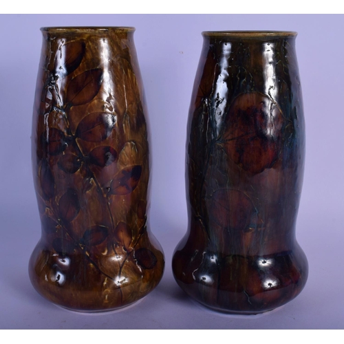 44 - A PAIR OF ROYAL DOULTON STONEWARE VASES painted with leaves. 20 cm high.