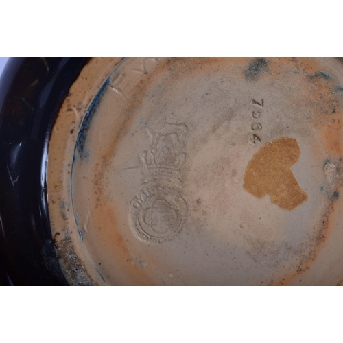 44 - A PAIR OF ROYAL DOULTON STONEWARE VASES painted with leaves. 20 cm high.