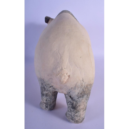 48 - A CONTEMPORARY PAINTED POTTERY MODEL OF A PANDA modelled roaming. 35 cm x 25 cm.