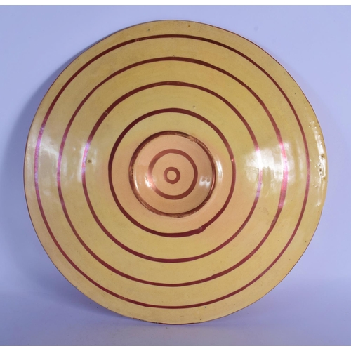 50 - A 19TH CENTURY SPANISH HISPANO MORESQUE TIN GLAZED CHARGER painted with motifs. 40 cm diameter.
