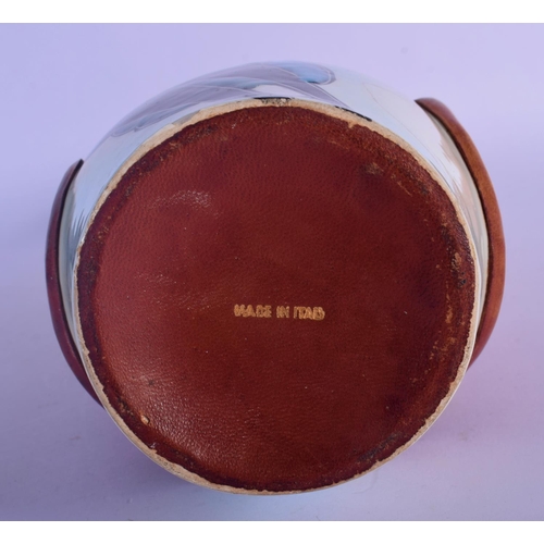 52 - A RETRO ITALIAN LEATHER AND PORCELAIN VASE. 33 cm high.