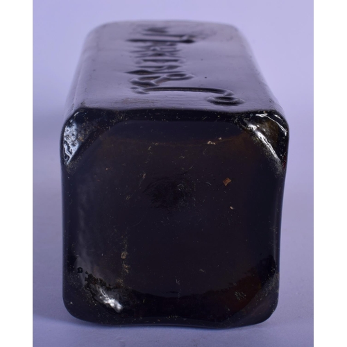 53 - AN 18TH CENTURY WEST INDIAN GREEN GLASS GIN BOTTLE. 25 cm high.