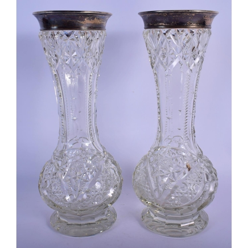 57 - A LARGE PAIR OF ENGLISH SILVER MOUNTED CUT GLASS VASES. 31 cm high.