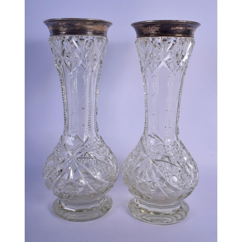 57 - A LARGE PAIR OF ENGLISH SILVER MOUNTED CUT GLASS VASES. 31 cm high.