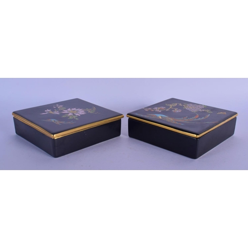 59 - A PAIR OF CARLTONWARE BLACK GROUND PORCELAIN BOXES AND COVERS painted with birds and flowers. 11.5 c... 