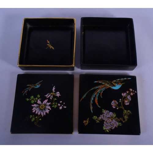 59 - A PAIR OF CARLTONWARE BLACK GROUND PORCELAIN BOXES AND COVERS painted with birds and flowers. 11.5 c... 