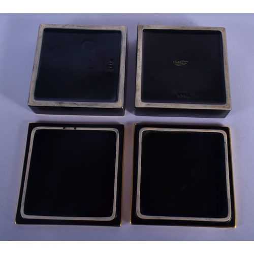 59 - A PAIR OF CARLTONWARE BLACK GROUND PORCELAIN BOXES AND COVERS painted with birds and flowers. 11.5 c... 