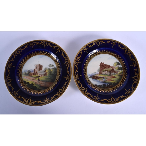 71 - EARLY 19TH C. COALPORT FINE PAIR OF PLATES PAINTED WITH FINE LANDSCAPE SCENES . 22cm diameter (2)