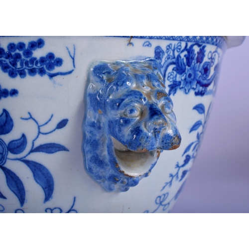 8 - A LARGE EARLY 19TH CENTURY ENGLISH BLUE AND WHITE TUREEN AND COVER decorated with bold foliage. 30 c... 