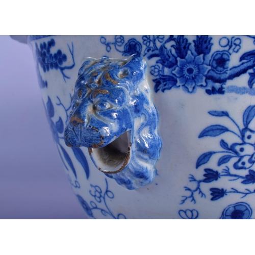 8 - A LARGE EARLY 19TH CENTURY ENGLISH BLUE AND WHITE TUREEN AND COVER decorated with bold foliage. 30 c... 