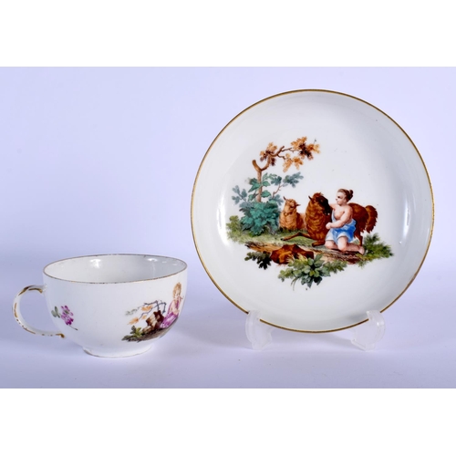 98 - MEISSEN TEACUP AND SAUCER PAINTED WITH A LANDSCAPE VIGNETTE DEPICTING CHILDREN IN CLASSICAL ROBES WI... 
