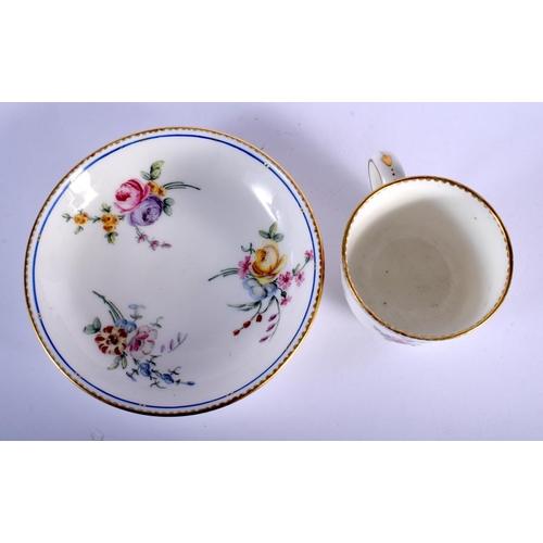 99 - 18TH C. SEVRES GOOD COFFEEE CUP AND SAUCER BOLDLLEY PAINTED WITH FLOWERS UNDER A BLUE LINE DENTIL GI... 