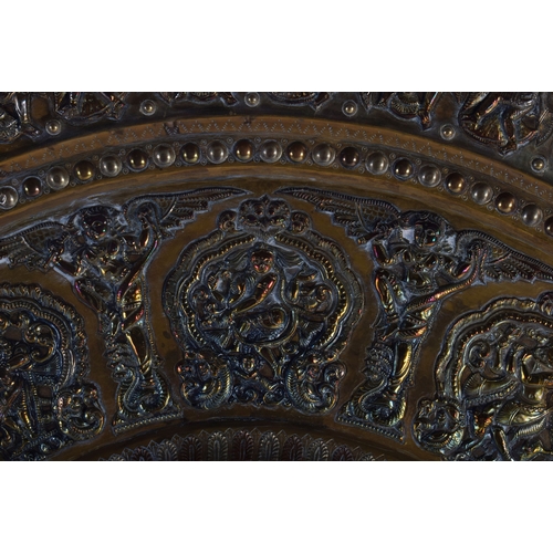 317 - A VERY LARGE 19TH CENTURY INDIAN MIDDLE EASTERN SILVER OVERLAID CHARGER of massive proportions, deco... 