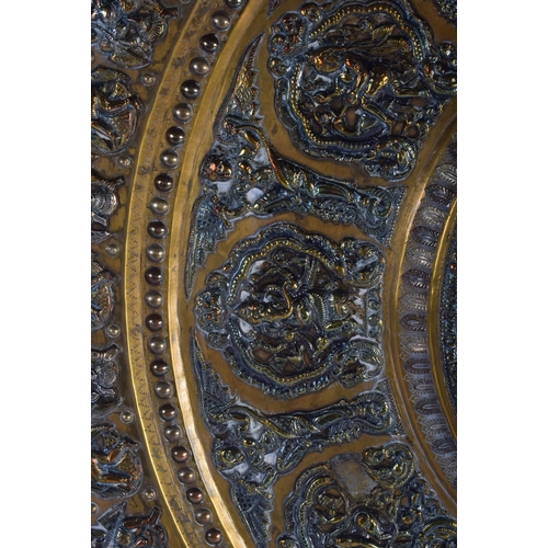 317 - A VERY LARGE 19TH CENTURY INDIAN MIDDLE EASTERN SILVER OVERLAID CHARGER of massive proportions, deco... 