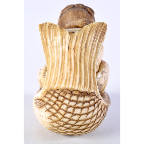 23 - A FINE 19TH CENTURY JAPANESE MEIJI PERIOD CARVED IVORY NETSUKE modelled as a male riding a fish. 5 c... 