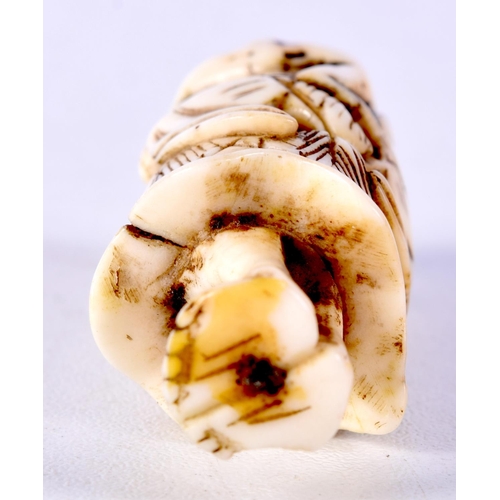 25 - A 19TH CENTURY JAPANESE MEIJI PERIOD CARVED IVORY NETSUKE modelled as a male holding a toad. 6 cm hi... 