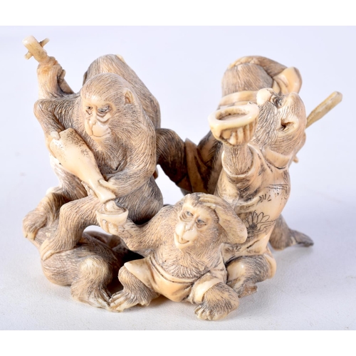 28 - A 19TH CENTURY JAPANESE MEIJI PERIOD CARVED IVORY OKIMONO modelled as numerous monkeys. 7 cm x 5 cm.