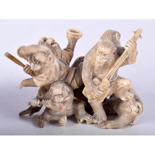 28 - A 19TH CENTURY JAPANESE MEIJI PERIOD CARVED IVORY OKIMONO modelled as numerous monkeys. 7 cm x 5 cm.