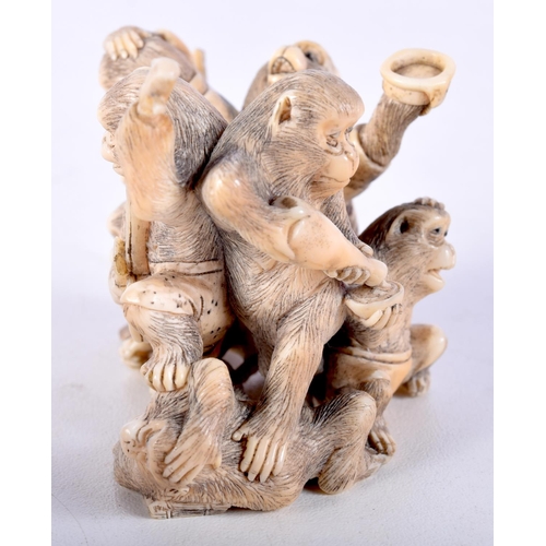 28 - A 19TH CENTURY JAPANESE MEIJI PERIOD CARVED IVORY OKIMONO modelled as numerous monkeys. 7 cm x 5 cm.