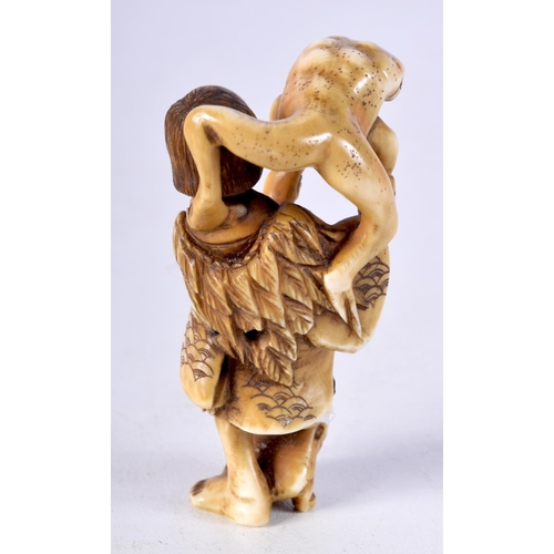 3 - A 19TH CENTURY JAPANESE MEIJI PERIOD CARVED IVORY NETSUKE in the form of scholar holding a toad. 7.2... 