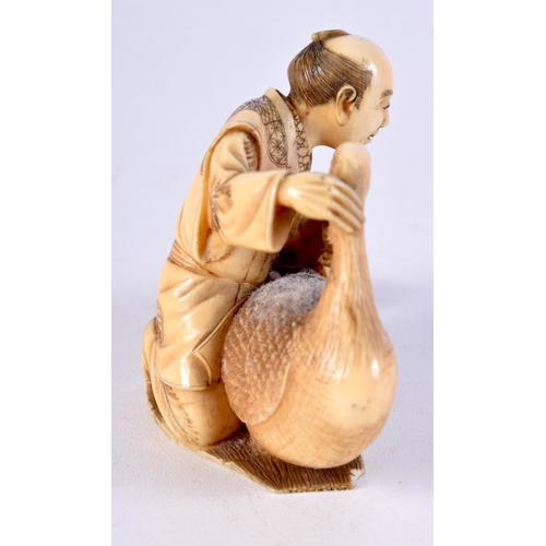 4 - A 19TH CENTURY JAPANESE MEIJI PERIOD CARVED IVORY OKIMONO modelled as a male holding a bird. 8.5 cm ... 
