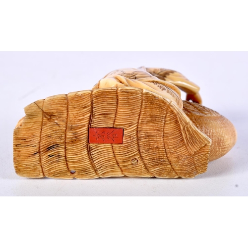 4 - A 19TH CENTURY JAPANESE MEIJI PERIOD CARVED IVORY OKIMONO modelled as a male holding a bird. 8.5 cm ... 