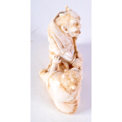41 - A 19TH CENTURY JAPANESE MEIJI PERIOD CARVED IVORY OKIMONO modelled as two devilish figures. 8 cm x 4... 