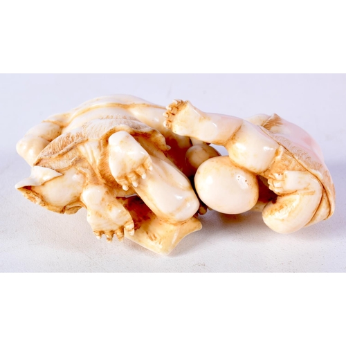 41 - A 19TH CENTURY JAPANESE MEIJI PERIOD CARVED IVORY OKIMONO modelled as two devilish figures. 8 cm x 4... 