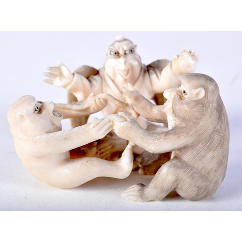 44 - A 19TH CENTURY JAPANESE MEIJI PERIOD CARVED IVORY OKIMONO modelled as monkeys and birds. 6.5 cm x 4 ... 