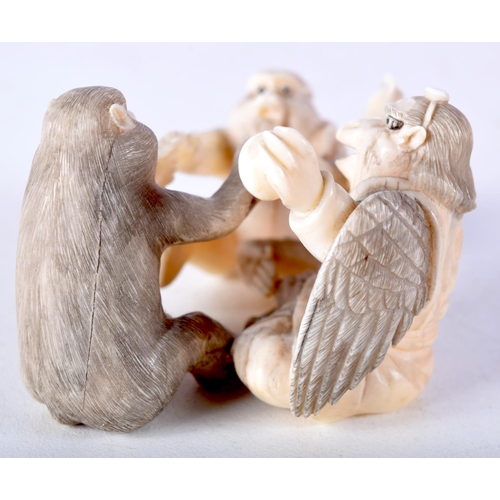 44 - A 19TH CENTURY JAPANESE MEIJI PERIOD CARVED IVORY OKIMONO modelled as monkeys and birds. 6.5 cm x 4 ... 