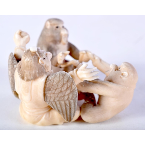 44 - A 19TH CENTURY JAPANESE MEIJI PERIOD CARVED IVORY OKIMONO modelled as monkeys and birds. 6.5 cm x 4 ... 