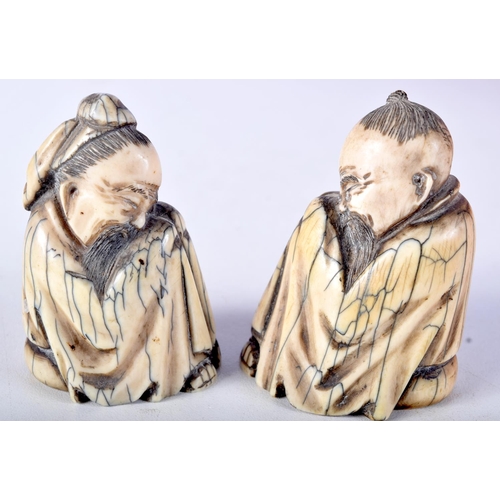 50 - A PAIR OF 19TH CENTURY CHINESE CARVED MAMMOTH IVORY FIGURES OF SCHOLARS modelled in robes. 7 cm x 4.... 