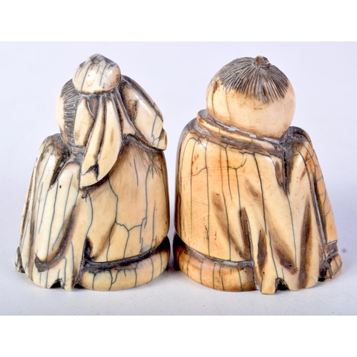 50 - A PAIR OF 19TH CENTURY CHINESE CARVED MAMMOTH IVORY FIGURES OF SCHOLARS modelled in robes. 7 cm x 4.... 