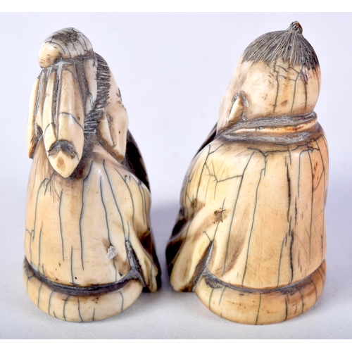 50 - A PAIR OF 19TH CENTURY CHINESE CARVED MAMMOTH IVORY FIGURES OF SCHOLARS modelled in robes. 7 cm x 4.... 