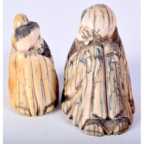 51 - TWO 19TH CENTURY CHINESE CARVED MAMMOTH IVORY FIGURES OF SCHOLARS. Largest 5.5 cm x 5.5 cm. (2)